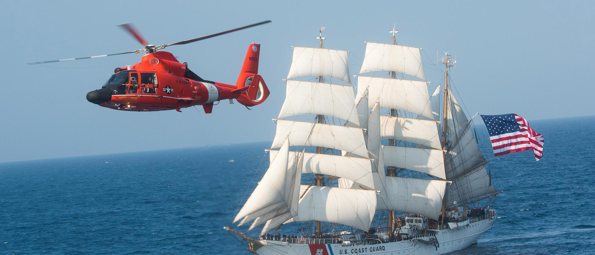 Picture of a chopper and a boat in sea